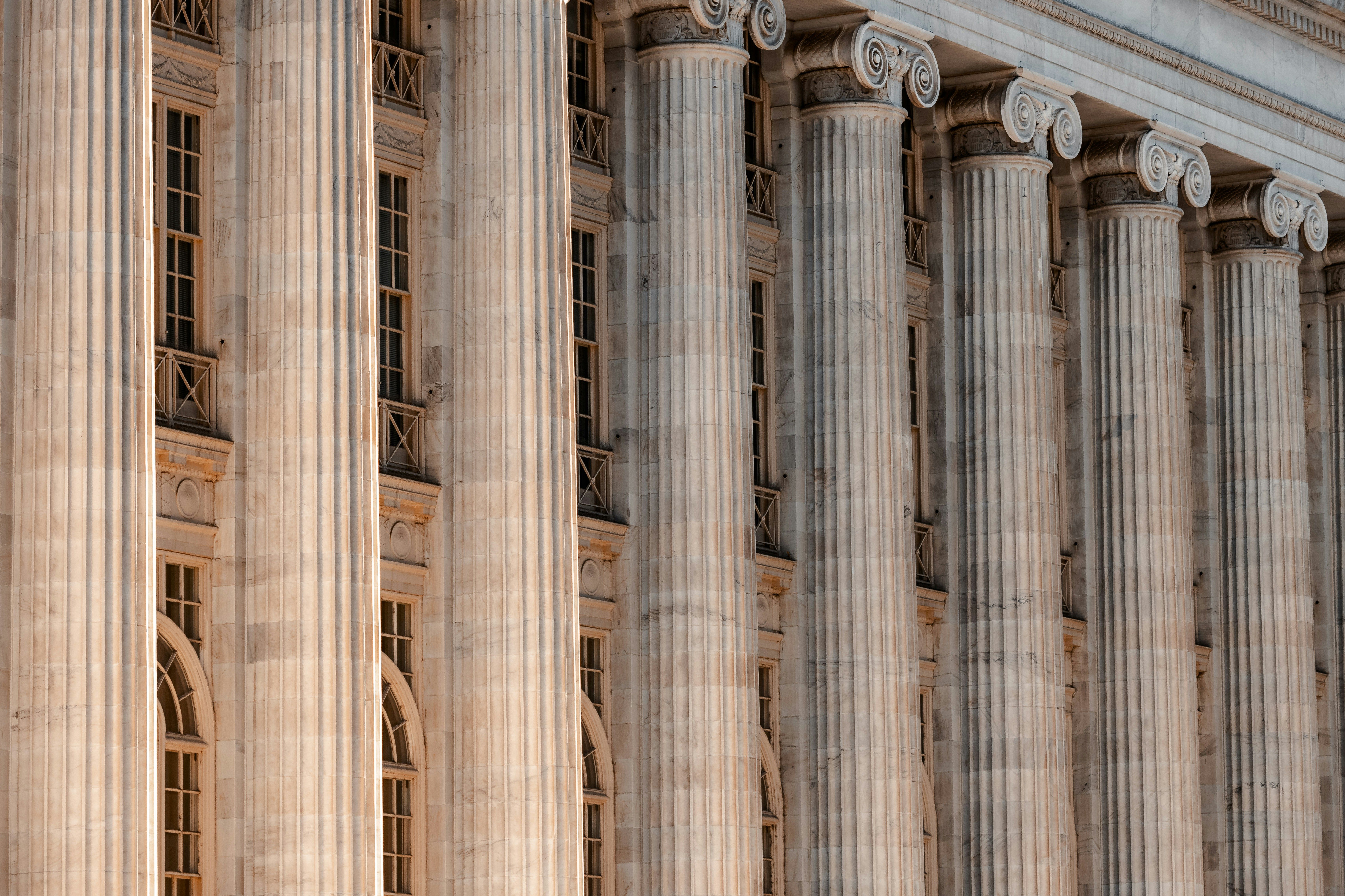 Federal courthouse columns representing the CIT IEEPA refund case transition to Freestyle World